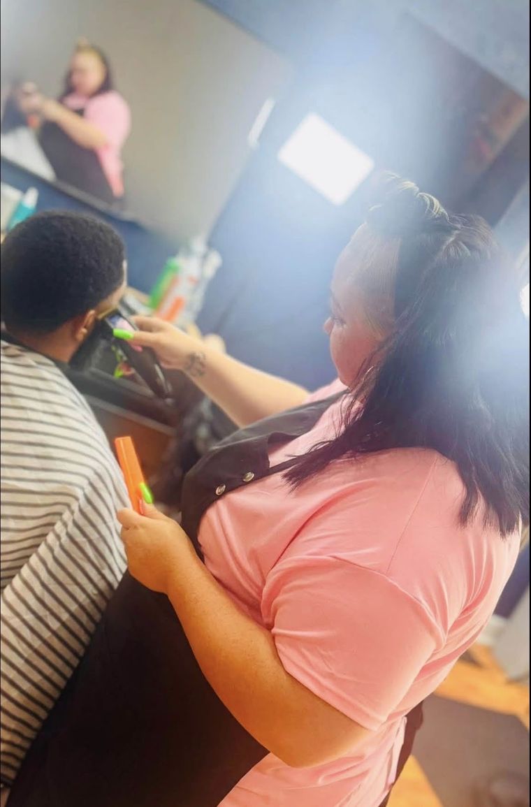 Rene at Murphy's Barber Co working on a client's hairline